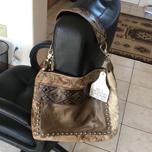 Holy Cow Couture hair on hide studded handbag